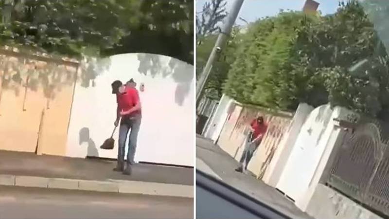 (VIDEO) Val de ironii după ce Klaus Iohannis a fost filmat în timp ce mătură trotuarul în fața casei sale din Sibiu: „La Cotroceni a curățat de bani” / „Nu mai sunt bani de avioane private”