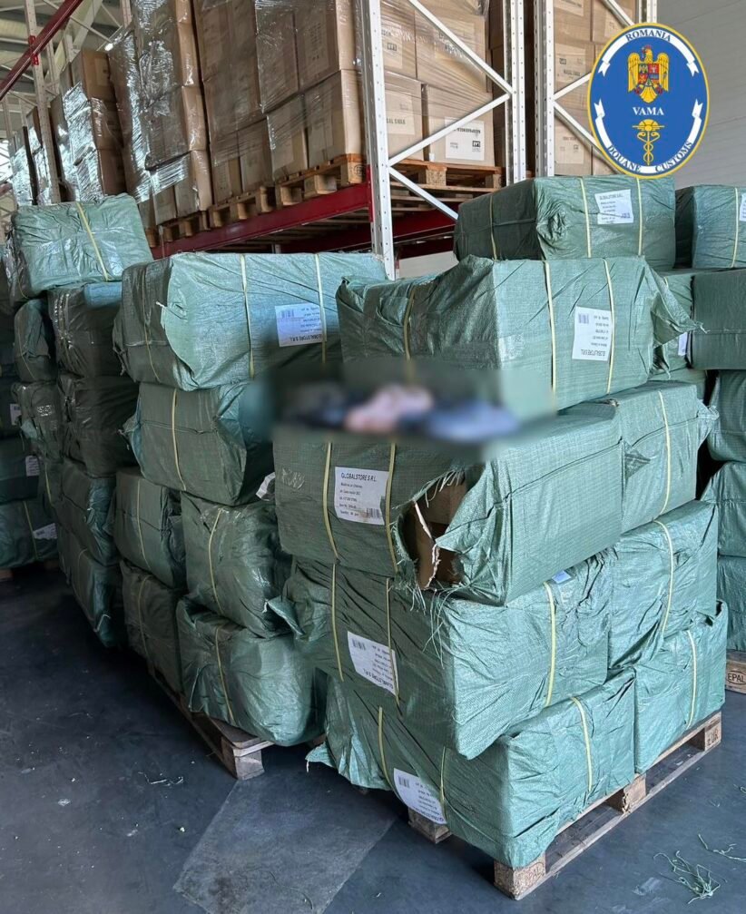 Stacks of green-wrapped bundles on wooden pallets in a warehouse, with a Romanian customs logo visible in the top right corner and labels on the bundles.