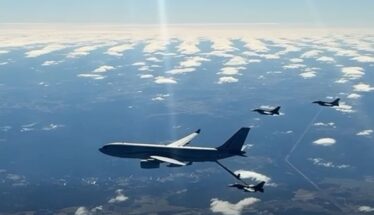 Large military tanker aircraft refuels a fighter jet in mid-air, with other jets nearby over a partly cloudy sky.