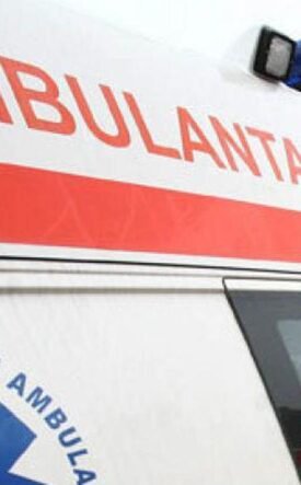 Ambulance with a red stripe and blue medical emblem, 112 visible on the side window.