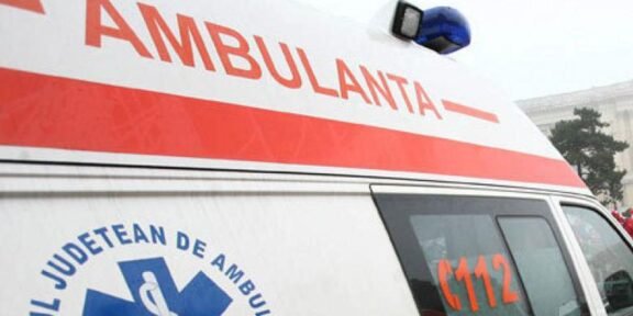 Ambulance with a red stripe and blue medical emblem, 112 visible on the side window.