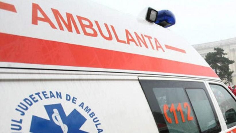 Ambulance with a red stripe and blue medical emblem, 112 visible on the side window.