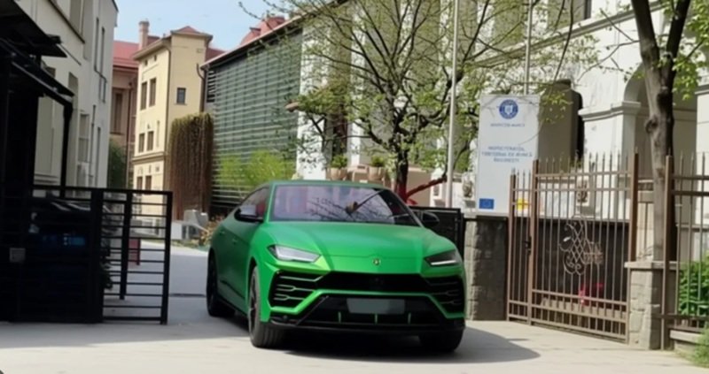 Bright green Lamborghini SUV driving down a gated residential street with parked cars and trees on a sunny day.