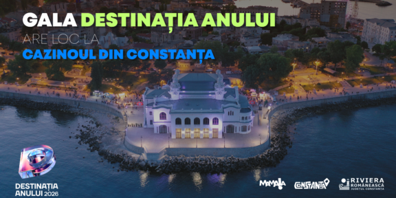 Aerial view of a illuminated casino on a rocky peninsula at dusk promoting Gala Destinația Anului 2026 at the Constanța Casino.