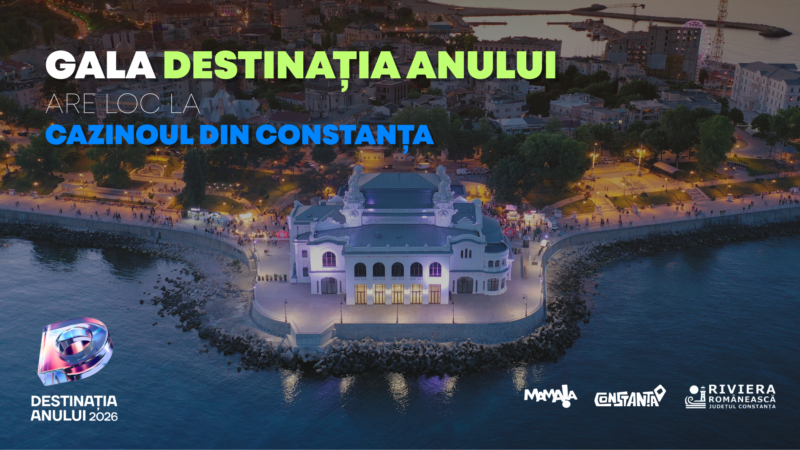 Aerial view of a illuminated casino on a rocky peninsula at dusk promoting Gala Destinația Anului 2026 at the Constanța Casino.