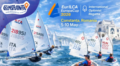 Sailing boats racing in a regatta off Constanța, Romania, with event logos and the date 5–10 May 2026 in the blue sky background.
