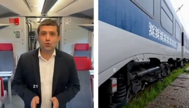 Split image: a man in a dark suit speaking to the camera inside a train carriage, with red seats behind him; on the right, a blue and white passenger train on tracks.