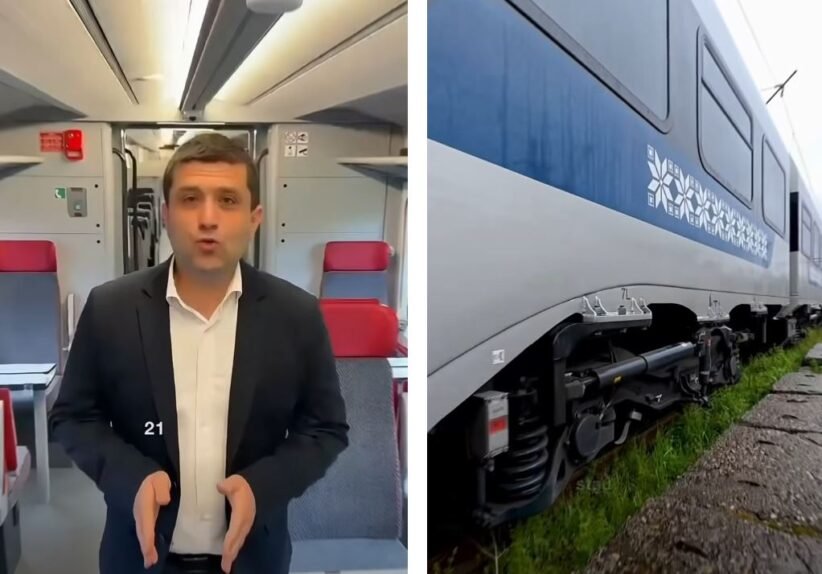Split image: a man in a dark suit speaking to the camera inside a train carriage, with red seats behind him; on the right, a blue and white passenger train on tracks.