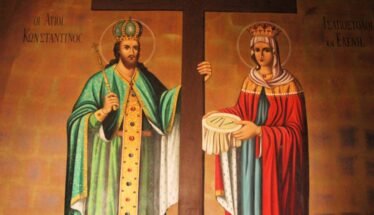 Iconic painting of Saint Constantine (left) and Saint Helen (right) with a wooden cross between them.