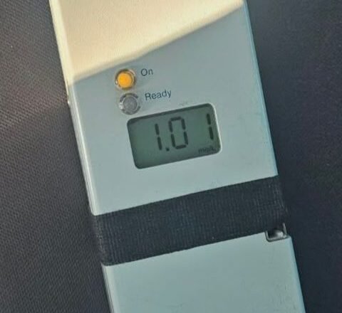 Handheld dosing device showing 1.0 ml dose, with On and Ready indicators visible.