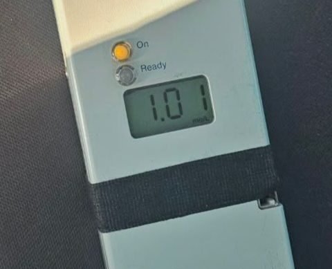 Handheld dosing device showing 1.0 ml dose, with On and Ready indicators visible.