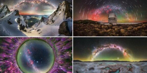 Snowy mountain peaks at twilight with an arc of stars and aurora overhead against a dark sky.