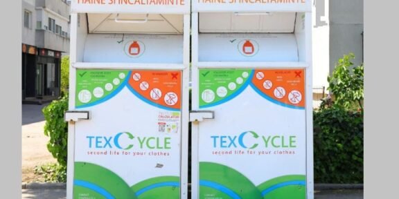 Two large white textile recycling bins labeled TEX CYCLE for clothing and shoes, with green and blue graphic panels.