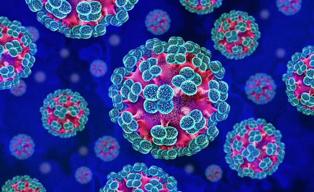 Colorized illustration of multiple spherical viruses with blue spike proteins on a blue background, showing a cluster of coronavirus-like particles.