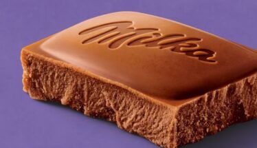 Milk chocolate bar with the Milka logo embossed on a purple background.