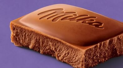 Milk chocolate bar with the Milka logo embossed on a purple background.