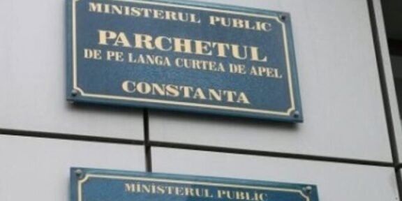 Two blue signs on a wall reading 'Ministerul Public' and 'Parchetul de pe lângă Curtea de Apel Constanța' (Constanța Public Prosecutor's Office).