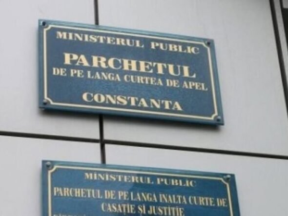 Two blue signs on a wall reading 'Ministerul Public' and 'Parchetul de pe lângă Curtea de Apel Constanța' (Constanța Public Prosecutor's Office).