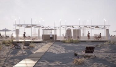 Open-air beach cabanas with white canopies along a wooden boardwalk, string lights, and beachgoers relaxing nearby on a sandy shore.