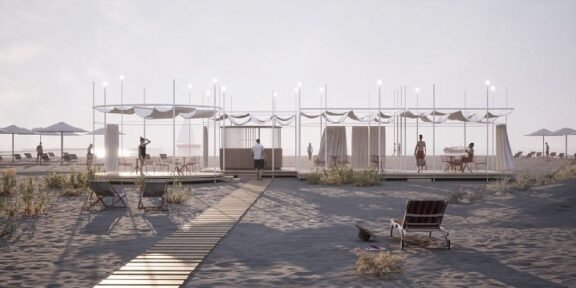 Open-air beach cabanas with white canopies along a wooden boardwalk, string lights, and beachgoers relaxing nearby on a sandy shore.