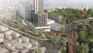 Aerial rendering of a modern urban district: a tall central tower, surrounding low-rise buildings, green parks, and an elevated pedestrian walkway weaving over curved roads.