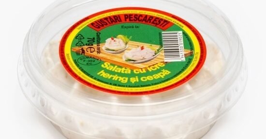 Plastic tub of fish salad spread with a bright red–green–yellow label, featuring text and a small image of the dish (herring and onion) on top.