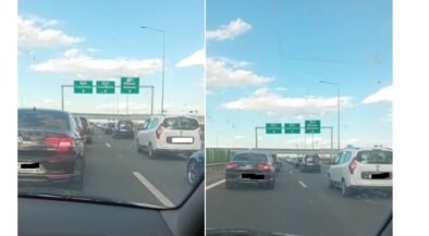 Split-screen view from inside a car showing a busy multi-lane highway with several cars and green overhead direction signs against a blue sky.