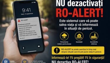 Hand holding a smartphone with a RO-ALERT warning notification.